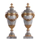 A pair of Neoclassical gris turquin marble cassolettes with bronze mount, H 53 cm