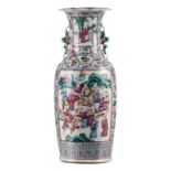 A Chinese famille rose decorated vase with a courtscene and warriors, 19thC, H 61 cm (chip to the