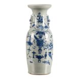 A Chinese celadon ground blue and white decorated vase with antiquities and flower branches, 19th C,