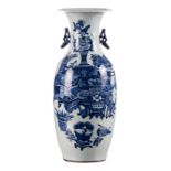 A Chinese blue and white vase, decorated with antiquities and flower vases, 19thC, H 58 cm