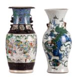 Two Chinese polychrome and relief decorated stoneware vases, one with Fû-lions, one with warriors,