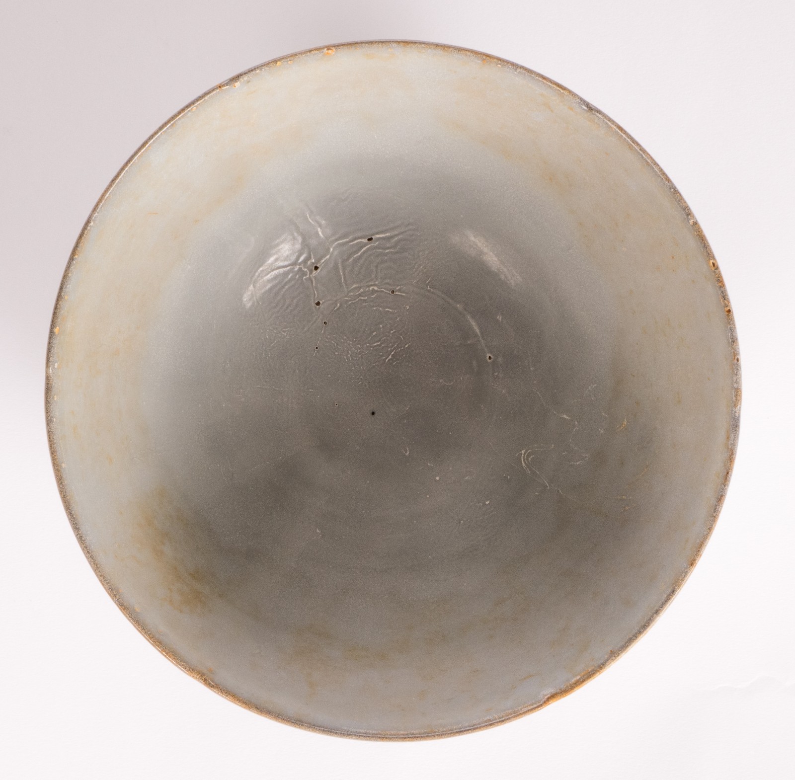 A Chinese celadon stoneware bowl, H 9,5 cm - Diameter 19,5 cm (chips, cracks and firing faults to - Image 5 of 10