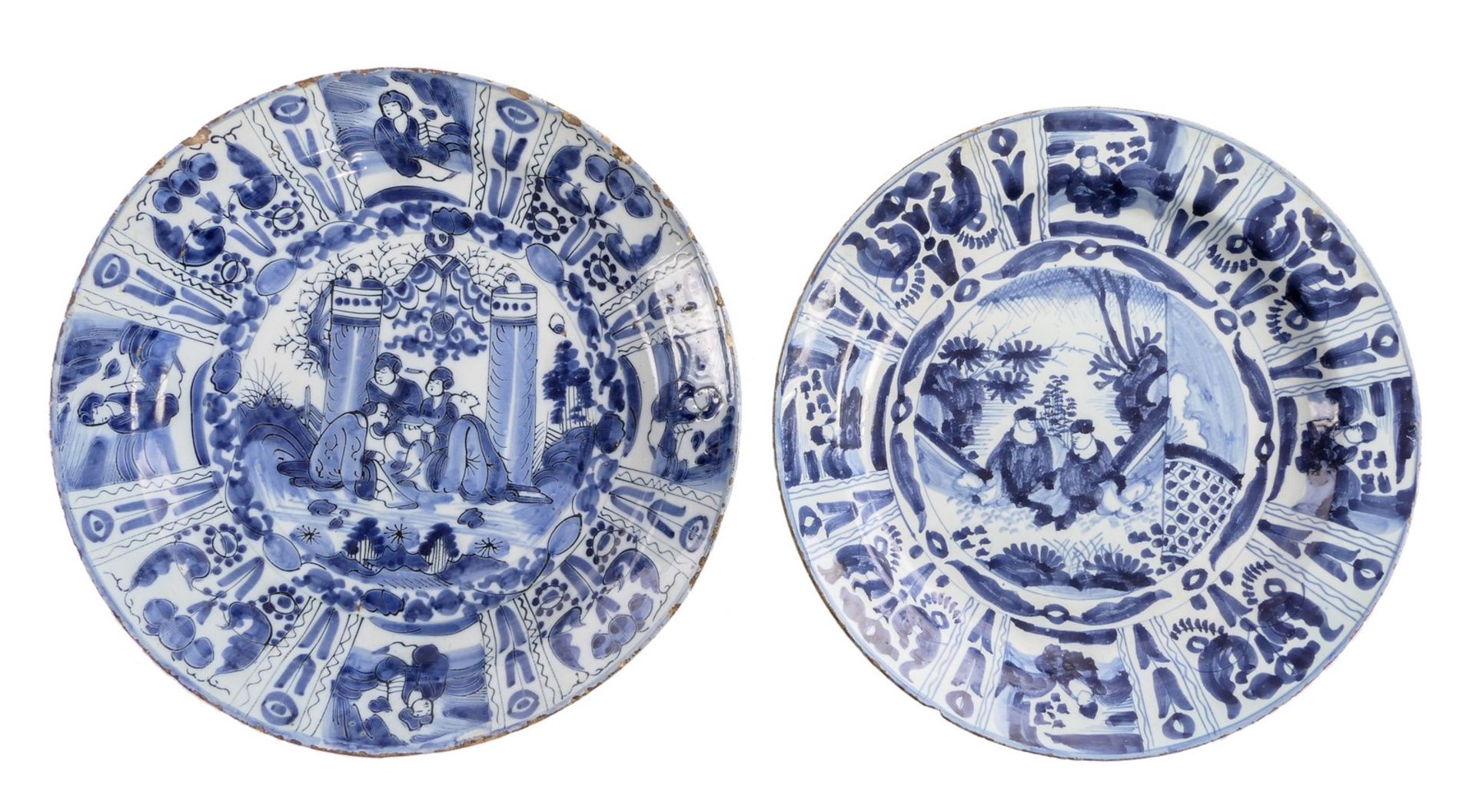 Two tin glazed and blue Wanli decorated Dutch Delftware plates, 17thC, (the usual glaze flaking to