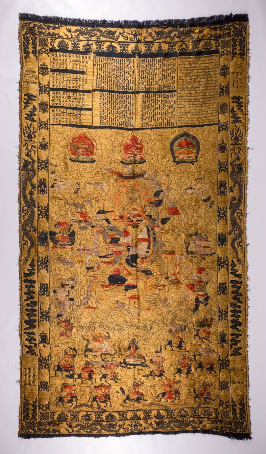 An extraordinary Chinese silk tapestry depicting scenes of a god, dragons and auspicious symbols - Image 3 of 14