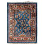 A Chinese wool rug decorated with dragons, auspicious symbols and geometric motifs, 244 x 335 cm