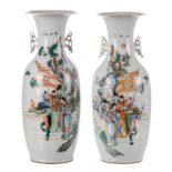 Two Chinese polychrome vases decorated with an animated scene, H 58,5 - 59 cm (crack to the bottom)