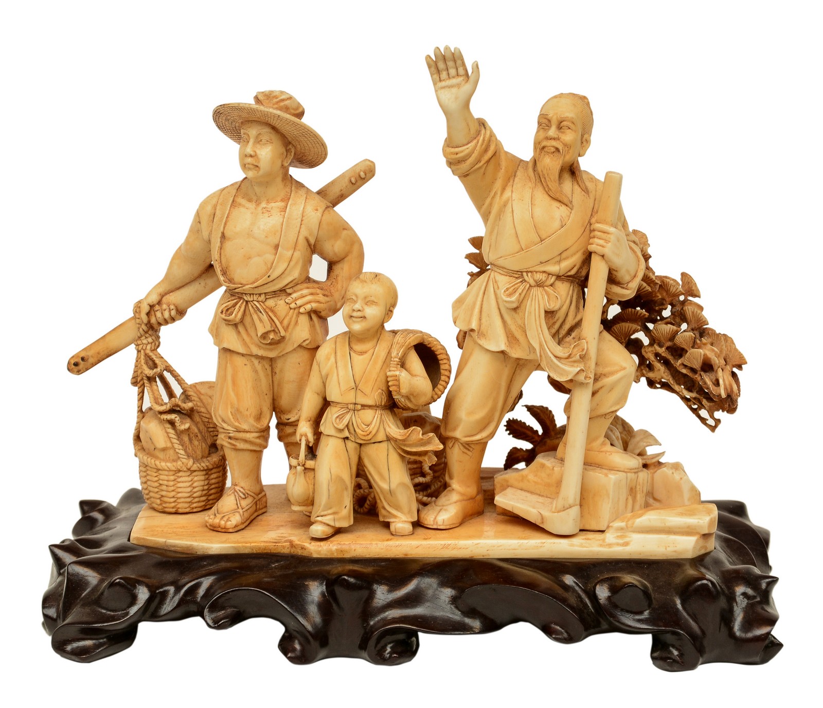 A Chinese ivory group depicting a rural scene, on a carved wooden base, first half 20thC, H 22,5 (