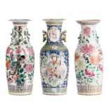 Three Chinese famille rose vases, one decorated with animated scenes, two vases with birds on flower