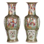 A pair of Chinese Canton famille rose balustre shaped vases, the roundels decorated with court