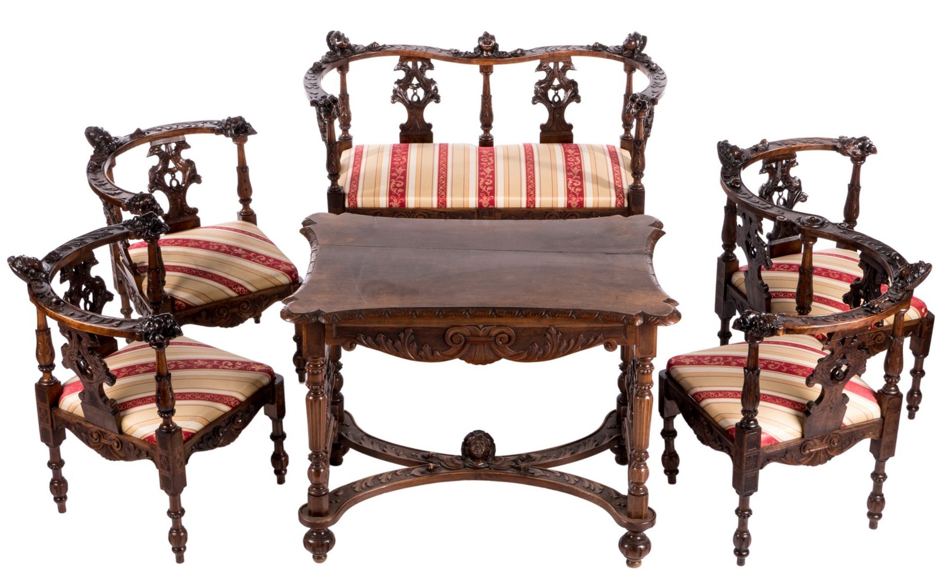 A late 19thC Neo-Renaissance walnut parlor set composed of a sofa, a confident, two corner chairs