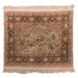 An Oriental silk rug with hunting scene, signed, 103,5 x 129,5 cm