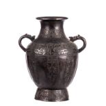 A Chinese archaic bronze vase, relief decorated with key patterns and mythical animals, the