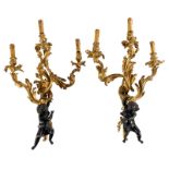A pair of patinated and gilt bronze wall lights in Rococo style, H 75 cm