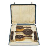 Five-piece toilet set in original box, tortoise shell with silver mounts, Birmingham hallmark, early