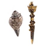 A Tibetan gilt bronze dorje dagger (phurba), 19thC, H 37 cm; added a Tibetan conshell with silver