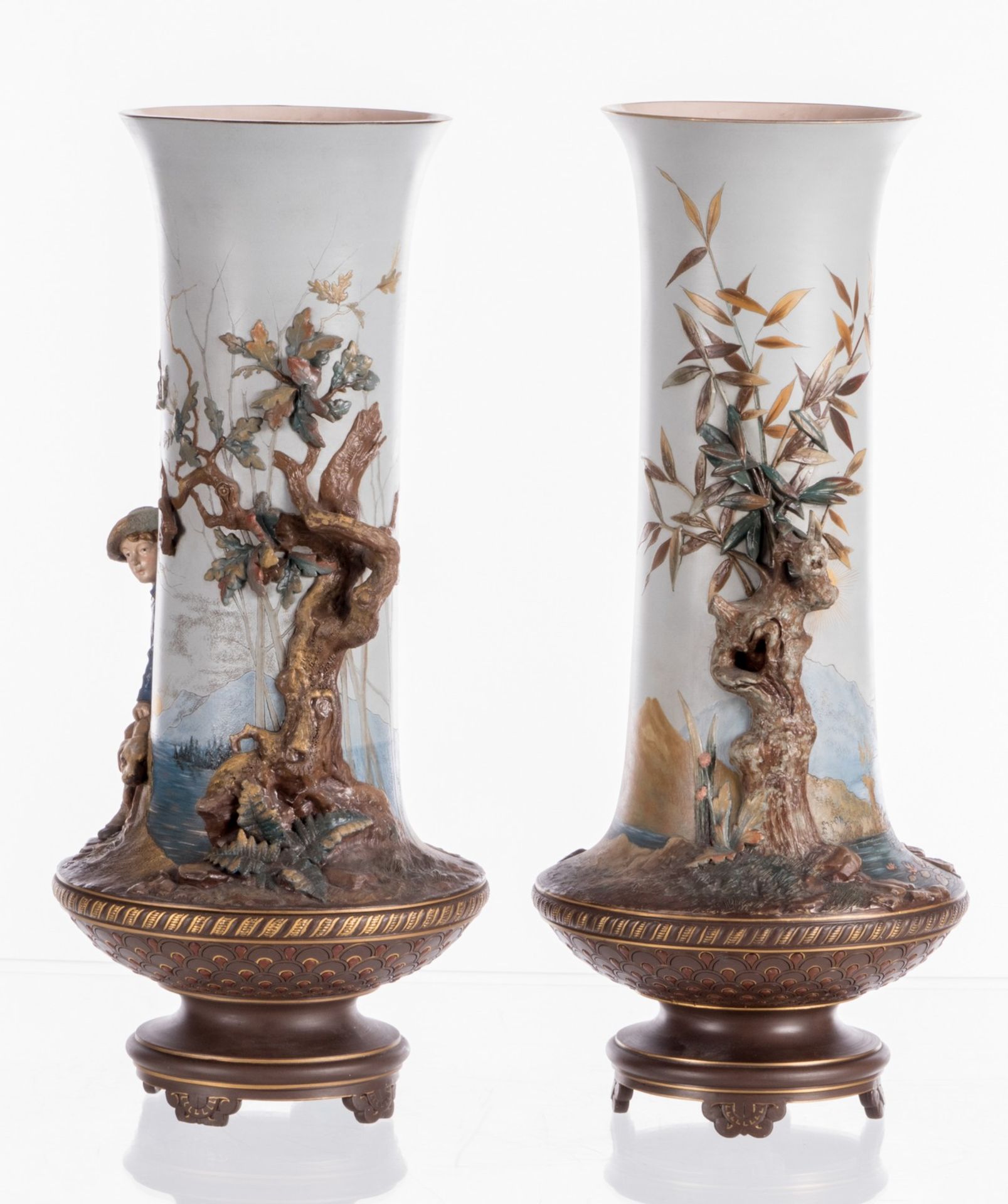 A pair of red stoneware vases, polychrome and partly cold painted relief decoration depicting - Image 3 of 11