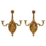 A pair of Neoclassical gilt bronze wall lights with masks, H 73 cm