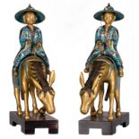 A pair of cloisonné and gilt bronze figures on donkeys on a wooden base, 19th, H 35 cm