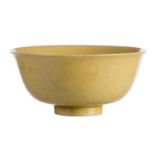 A Chinese yellow monochrome glazed relief decorated bowl, with a Yongzheng mark, H 7 - Diameter 15