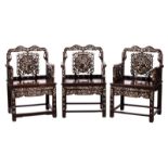 Three Chinese carved hardwood armchairs with mother-of-pearl inlay, depicting Fû-lions, birds on