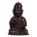 A Chinese bronze seated Buddha with traces of gilt and polychromy, H 31 cm (minor damage)