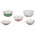 Three Chinese bowls, famille rose and polychrome, and a ditto bowl and cover, floral decorated,