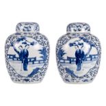 A pair of Chinese blue and white floral decorated pots and covers with a galant garden scene,