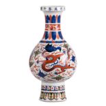A Chinese wucai bottle vase, overall decorated with dragons and phoenix, with a Wanli mark, H 51 cm