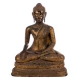 An Oriental gilt lacquer bronze Buddha, traces of polychromy and glass inlay, 19thC, H 92 - B 74,5 -