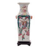 A Chinese quadrangular famille rose vase on a wooden base, decorated with courtscene and