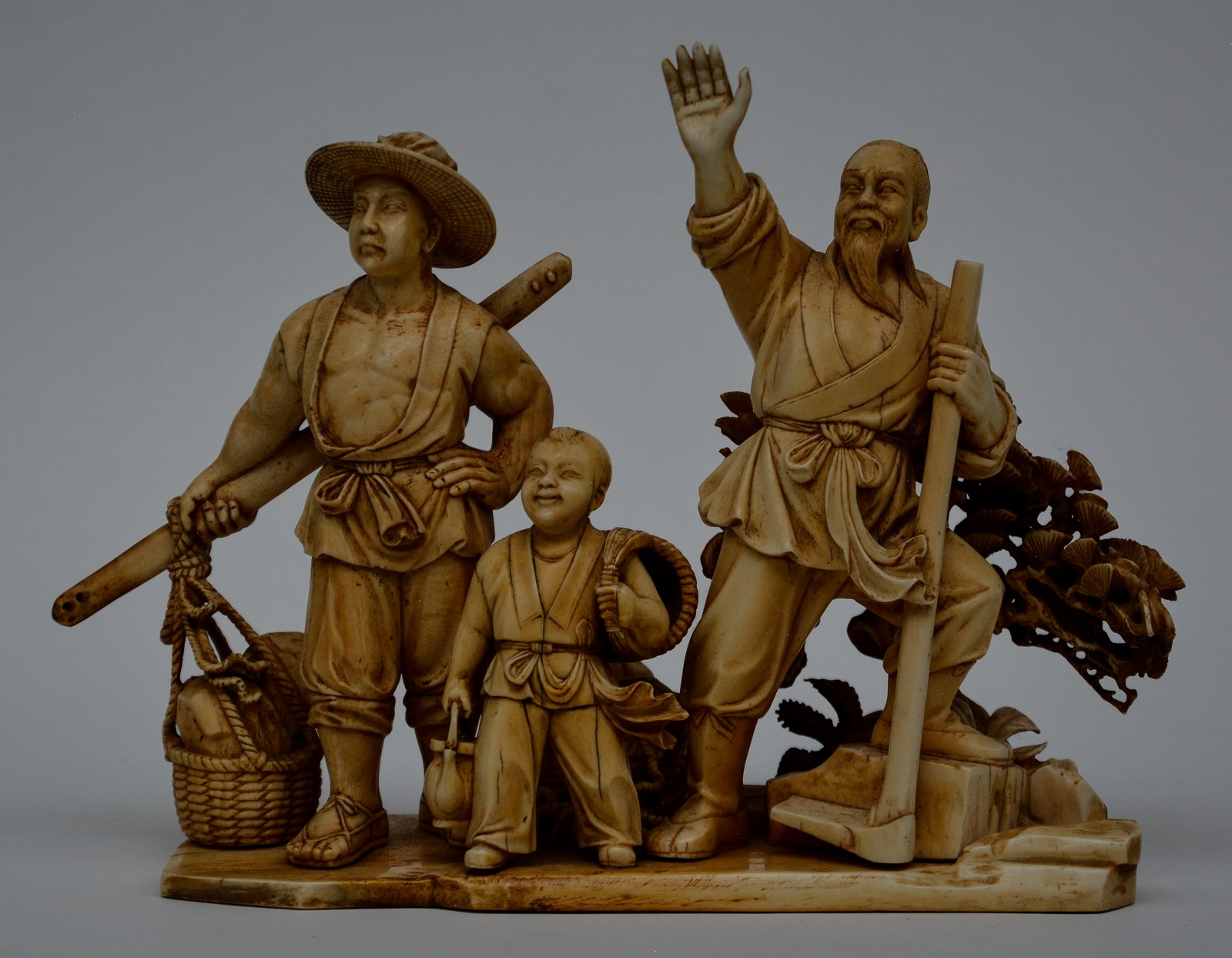 A Chinese ivory group depicting a rural scene, on a carved wooden base, first half 20thC, H 22,5 ( - Image 13 of 13