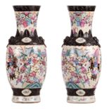 A pair of Chinese famille rose stoneware vases, overall decorated with warrior scenes, marked,