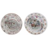 A Chinese famille rose bowl, decorated with children playing in a garden; added a ditto bowl,