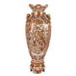 A particular Japanese Meiji period Satsouma vase on a base, decorated with warriors and an