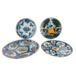 A lot of four so-called Dutch Delftware pancake  plates, three polychrome decorated (one depicting