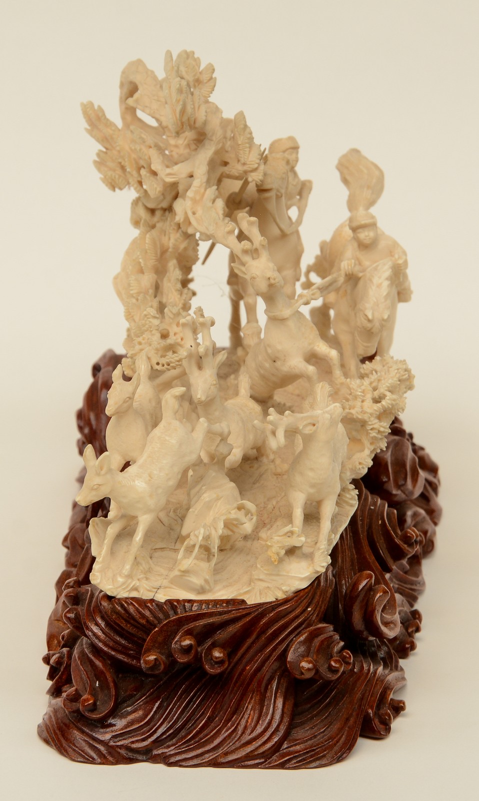 A Chinese ivory group depicting 'young heroes hunting for reindeers' on a carved wooden base, - Image 4 of 9