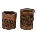 Two Chinese carved bamboo brush pots with literati in a landscape, 19thC, H 15 - 17 cm (cracks