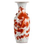 A Chinese iron red vase, decorated with Fû-lions and calligraphic texts, 19thC, H 58 cm