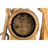 A gilt clock 'De près de loin', with an allegory of faith, hope and love, the dial marked 'Bled à