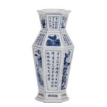 A Chinese hexagonal blue and white vase, decorated with flower branches, butterflies and