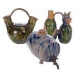A 19thC Westerwald stoneware brandy barrel; added two late 19thC green glazed earthenware jugs , H