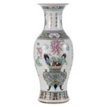 A Chinese famille rose baluster shaped vase, decorated with flowerbaskets, flower vases and