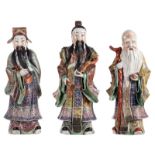 Three Chinese polychrome decorated 'Fu, Lu, Shou Xing' figures, marked, about 1900, H 43 - 46 cm (