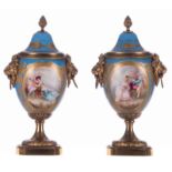 Two porcelain type Sèvres ornamental vases, bleu céleste ground, cartouches with genre scenes