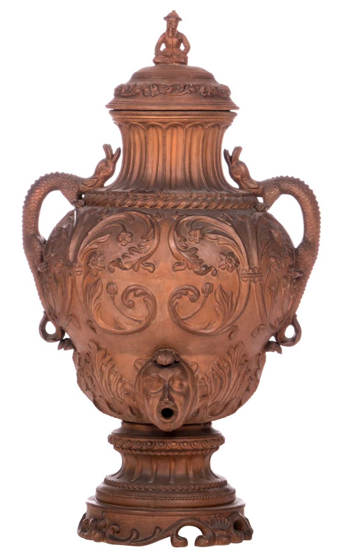 A terracotta wine fountain, overall decorated with Renaissance ornamental motives and on top a