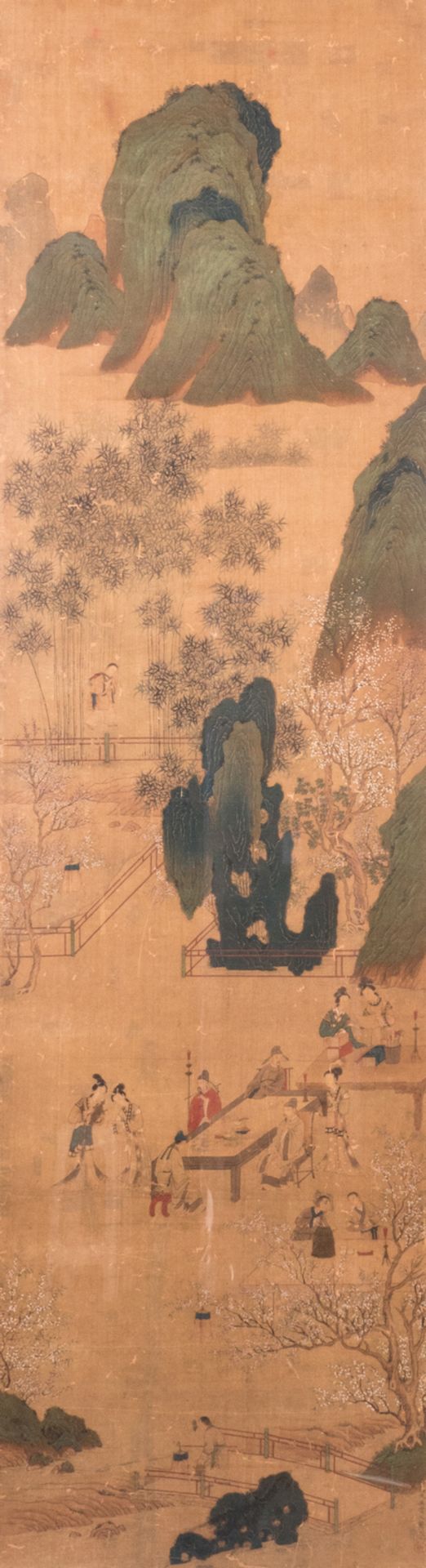 A Chinese scroll, framed, silk mount, depicting literati, courtisans and servants in a garden