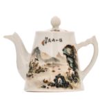 A Chinese polychrome decorated teapot and cover with a mountainous river landscape and