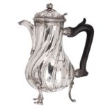 A silver Rococo coffee pot with ebony handle, presumably Paris and dated 1746, maker's mark P.B.I.?,