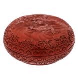 A Chinese red cinnabar floral and dragon decorated lacquer box and cover with a Qianlong mark, H