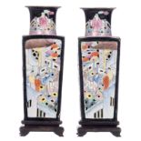 A pair of Chinese double walled quadrangular polychrome and openwork decorated vases with figures in